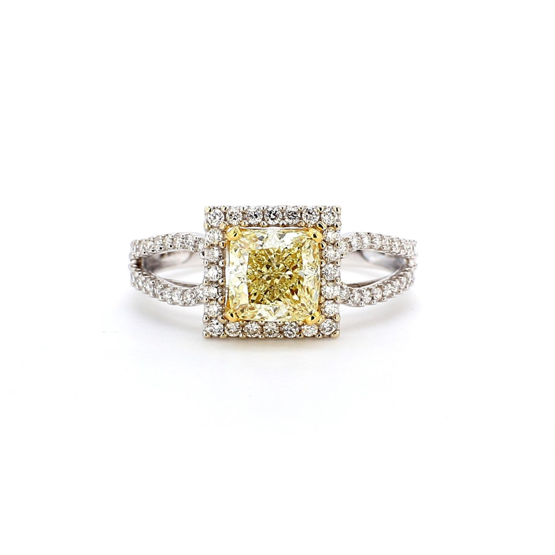 Halo split-shank ring in 18K WG with 4-prong set GIA certified FLY/VVS1 cushion cut center & prong set round diamonds.  D1.74ct.t.w.  (Center 1.40ct.)  Size 6