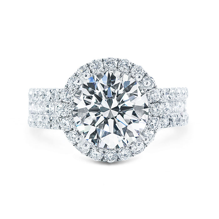 Halo semi-mount in 18K WG with french pave set round diamonds.  D1.30ct.t.w.