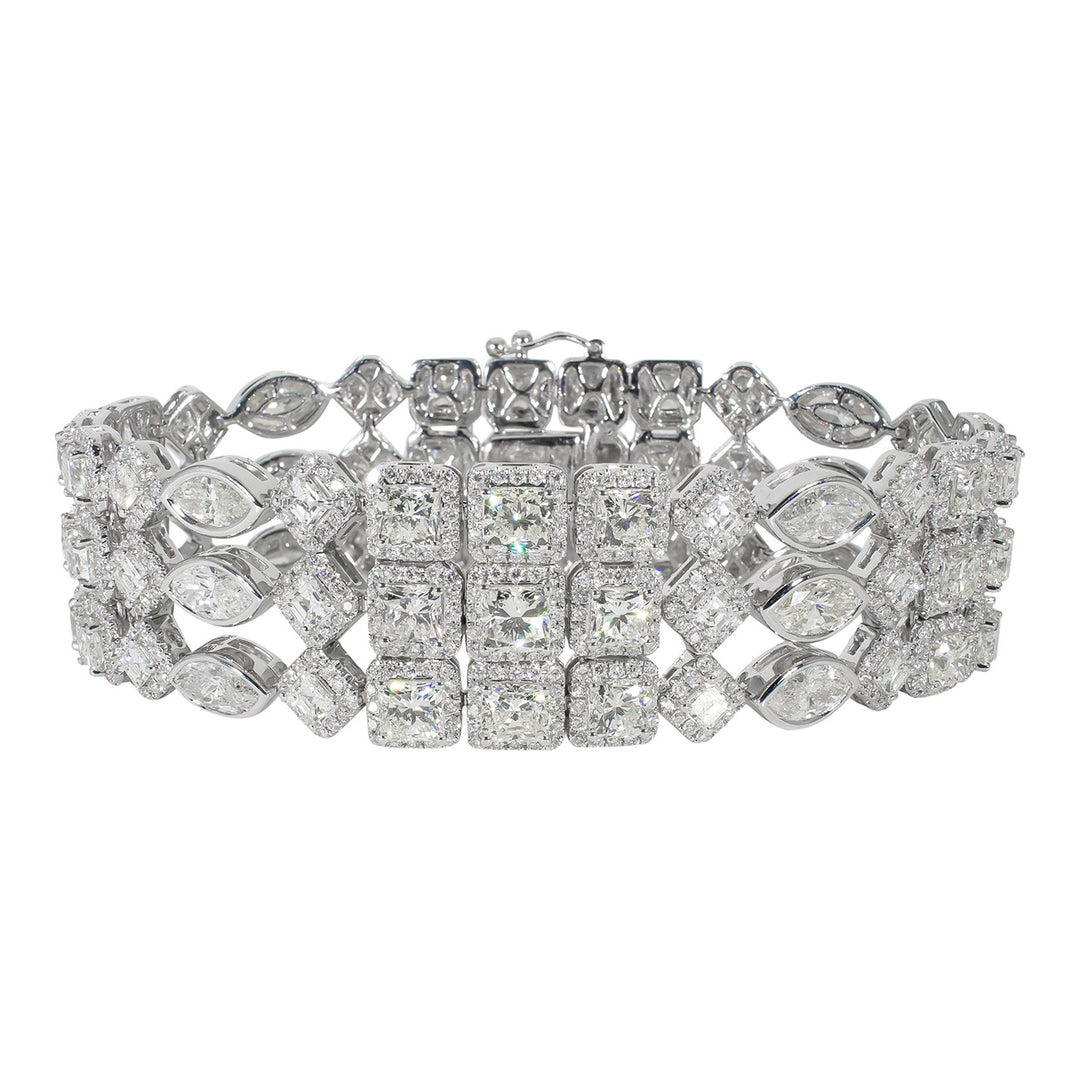Designer halo bracelet in 18K WG with multi-row french pave set rounds around cushion and asscher cuts, & bezel set marquise diamonds.  D30.56ct.t.w.