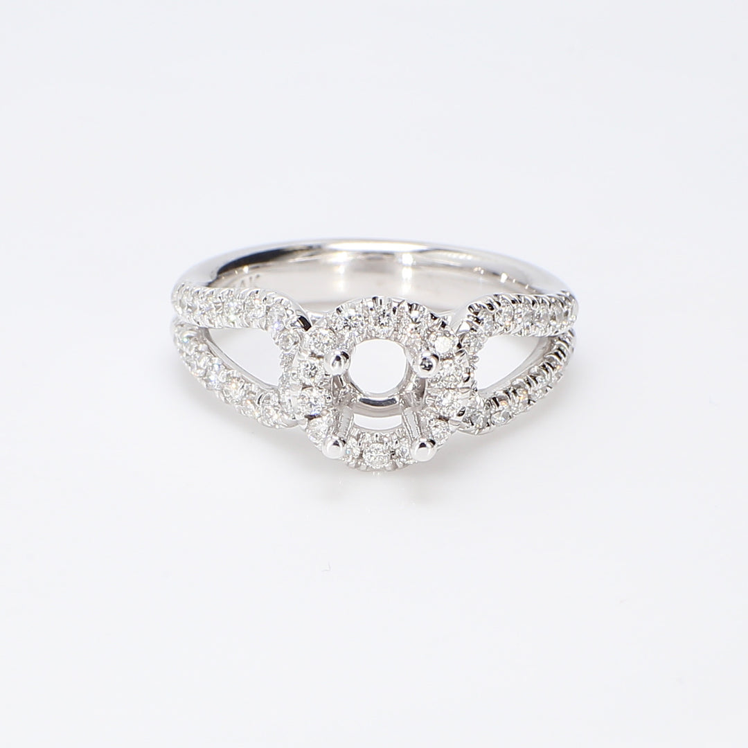 Halo split-shank semi-mount with U-prong set round diamonds. D0.55ct.t.w.