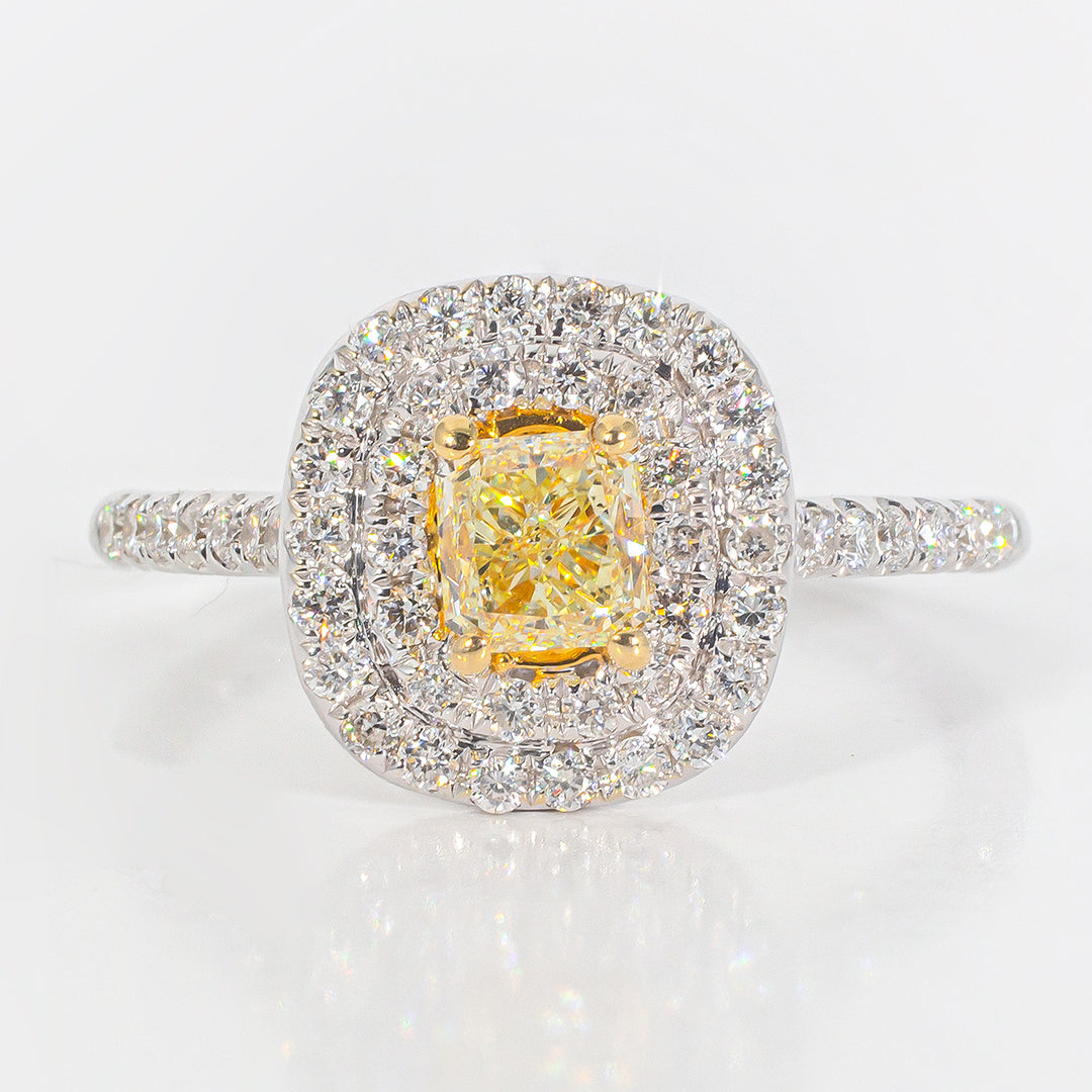 Double halo ring in 18K WG with rounds around a FY radiant cut diamond center stone.  D1.08ct.t.w.  (Center 0.63ct.)  Size 6.5