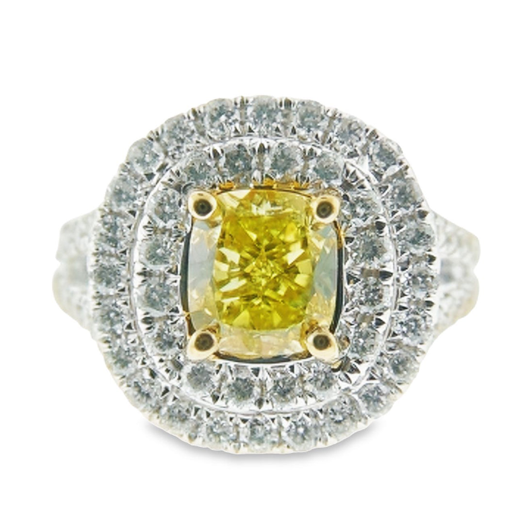 Double halo split shank ring in 18K WG withprong set rounds around a 4-prong set GIA certified FVY/SI1 cushion cut diamond center stone.  D1.89ct.t.w.  (Center - 1.02ct.)  Size 6.5