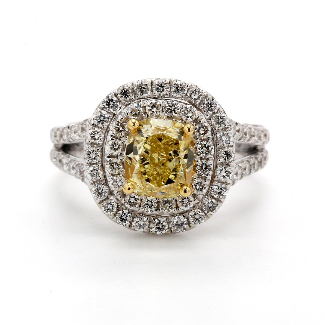 Double halo split-shank ring in 18K WG with 4-prong set GIA certified FY/VS2 cushion cut center & prong set round diamonds.  D2.43ct.t.w.  (Center 1.56ct.)