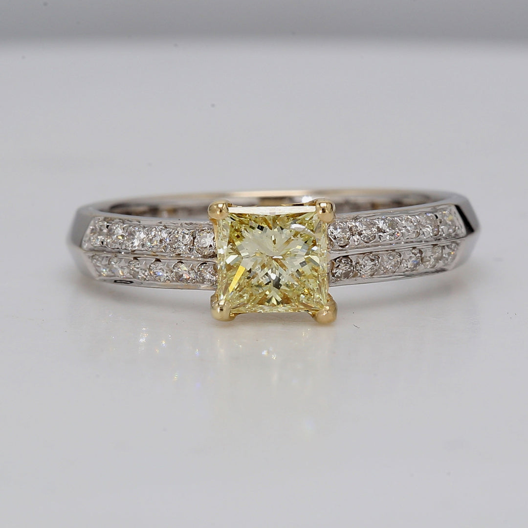 Ring in 18K 2-tone with prong set prong set GIA certified FLY/SI1 princess cut center and 2-row French Pave round diamonds along the shank.   D1.00ct.t.w.  (Center 0.71ct.)