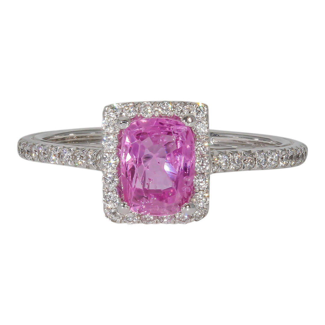 Halo ring with French pave set rounds around a 4-prong set pink sapphire center stone.  D0.25ct.t.w.  Sapphire 1.00ct.
