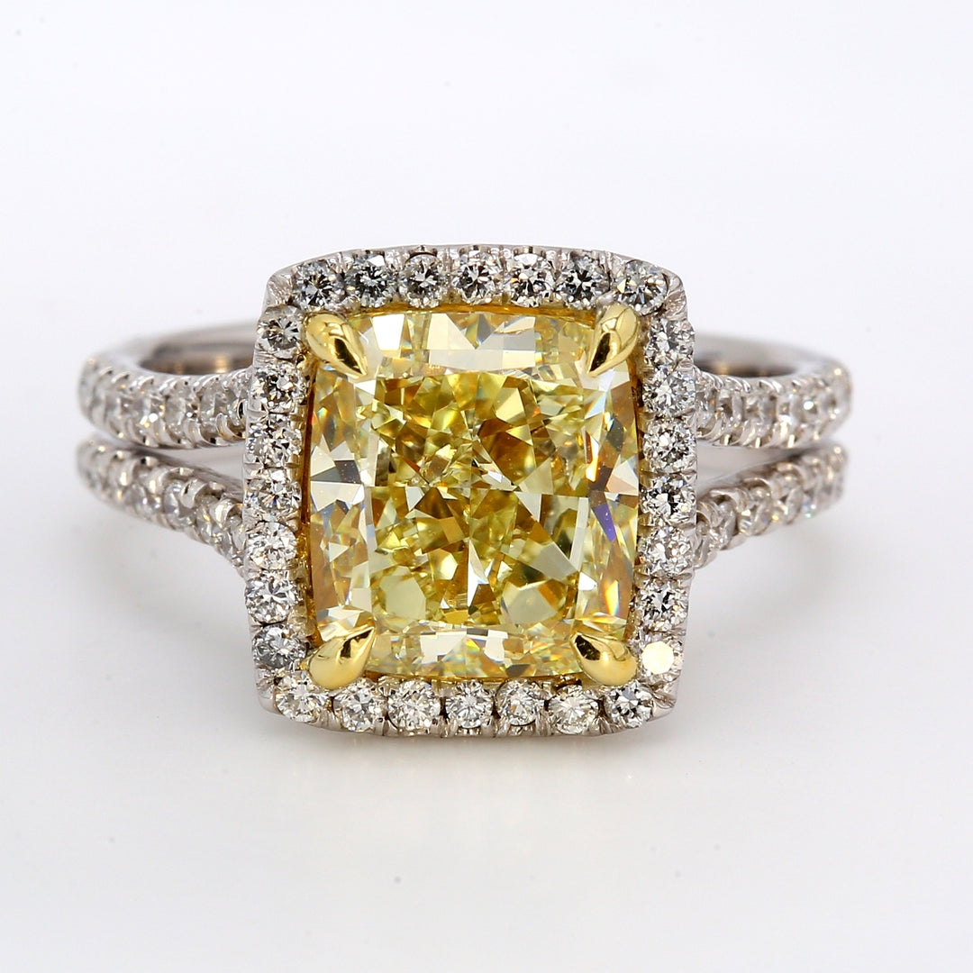 Halo split-shank ring with french pave set rounds around GIA certified FLY/VS1 cushion cut diamond center.  D5.05ct.t.w.  (Center 4.13ct.)  Size: 6.75