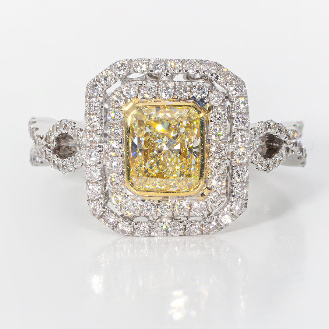 Double halo ring in 18K WG with bezel set GIA certified FY/VS2 radiant diamond center.  D1.65ct.t.w.  (Center 1.02ct.)