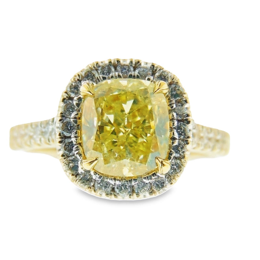Halo ring with prong set rounds around a 4-prong set GIA certified FLY/SI1 cushion cut diamond center stone.  D2.04ct.t.w.  (Center - 1.52ct.)  Size 6