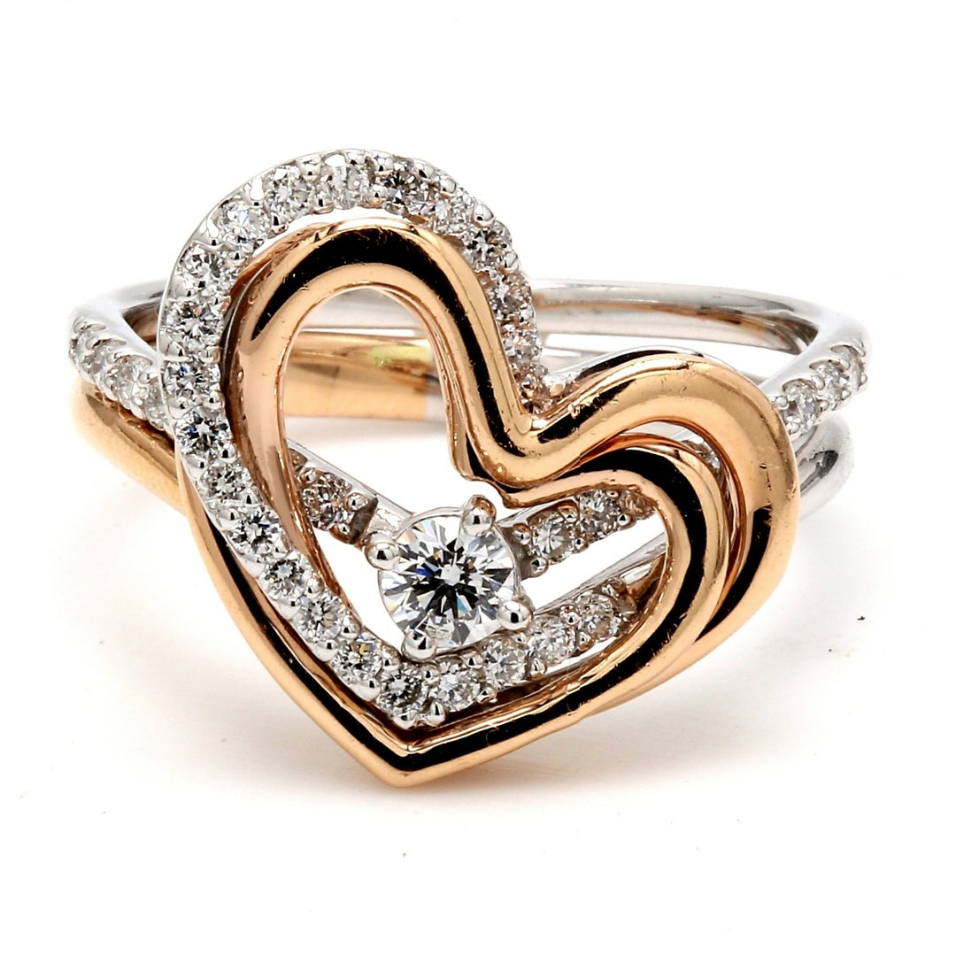 Fashion heart shaped ring in tri-color with prong set round diamonds. D0.52ct.t.w.