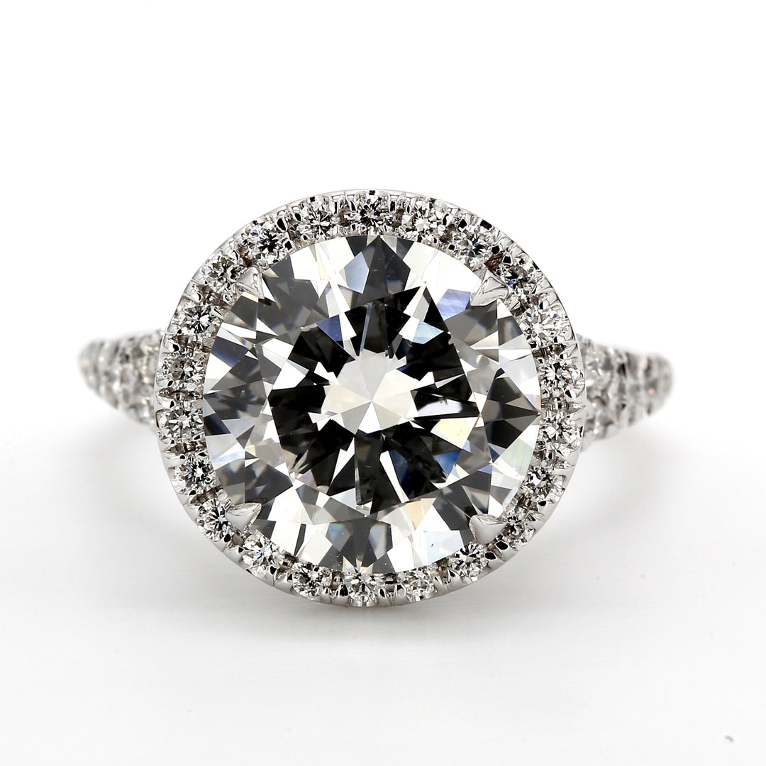 Halo split-shank semi-mount in 18K WG with U-prong set round diamonds.  D0.62ct.t.w.