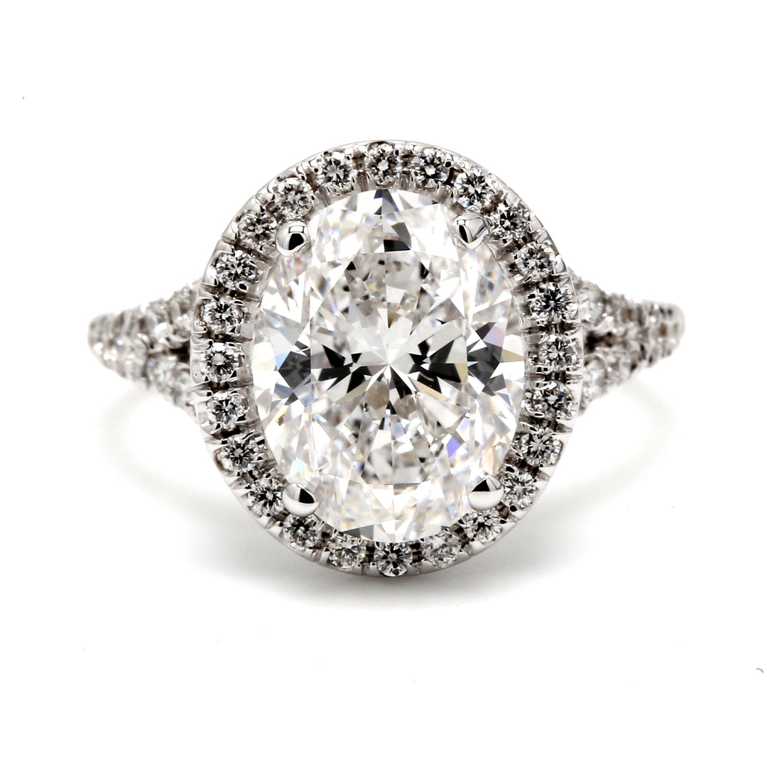 Halo split-shank semi-mount in 18K WG with U-prong set round diamonds.  D0.53ct.t.w.  Size 6.5
