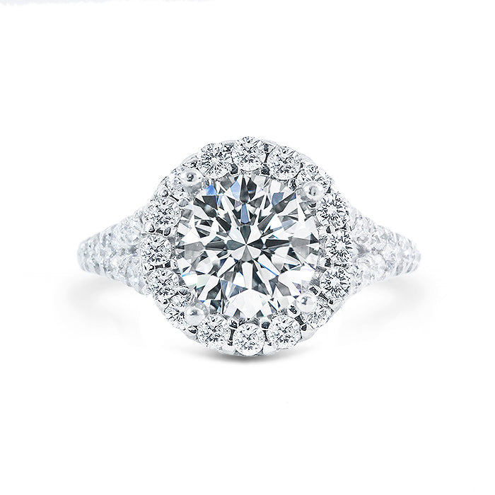 Halo split shank ring with claw set GIA certified D/SI2 round center and U-prong set round diamonds.  D3.75ct.t.w.  (Center 3.20ct.)  Size 6.5