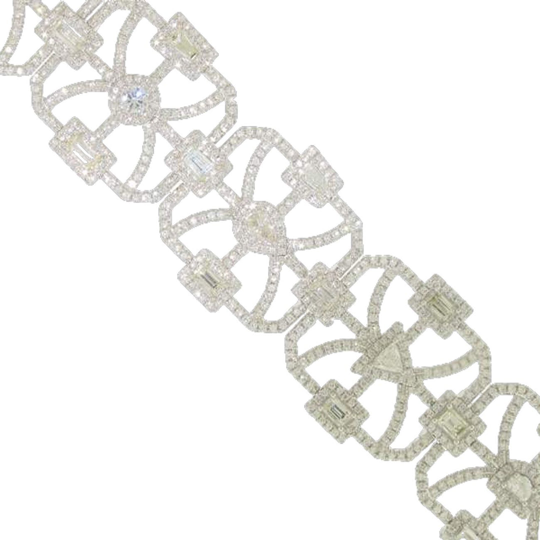 Halo designer bracelet in 18K WG with French pave set rounds around prong set fancy shaped diamond center stones.  D10.17ct.t.w.