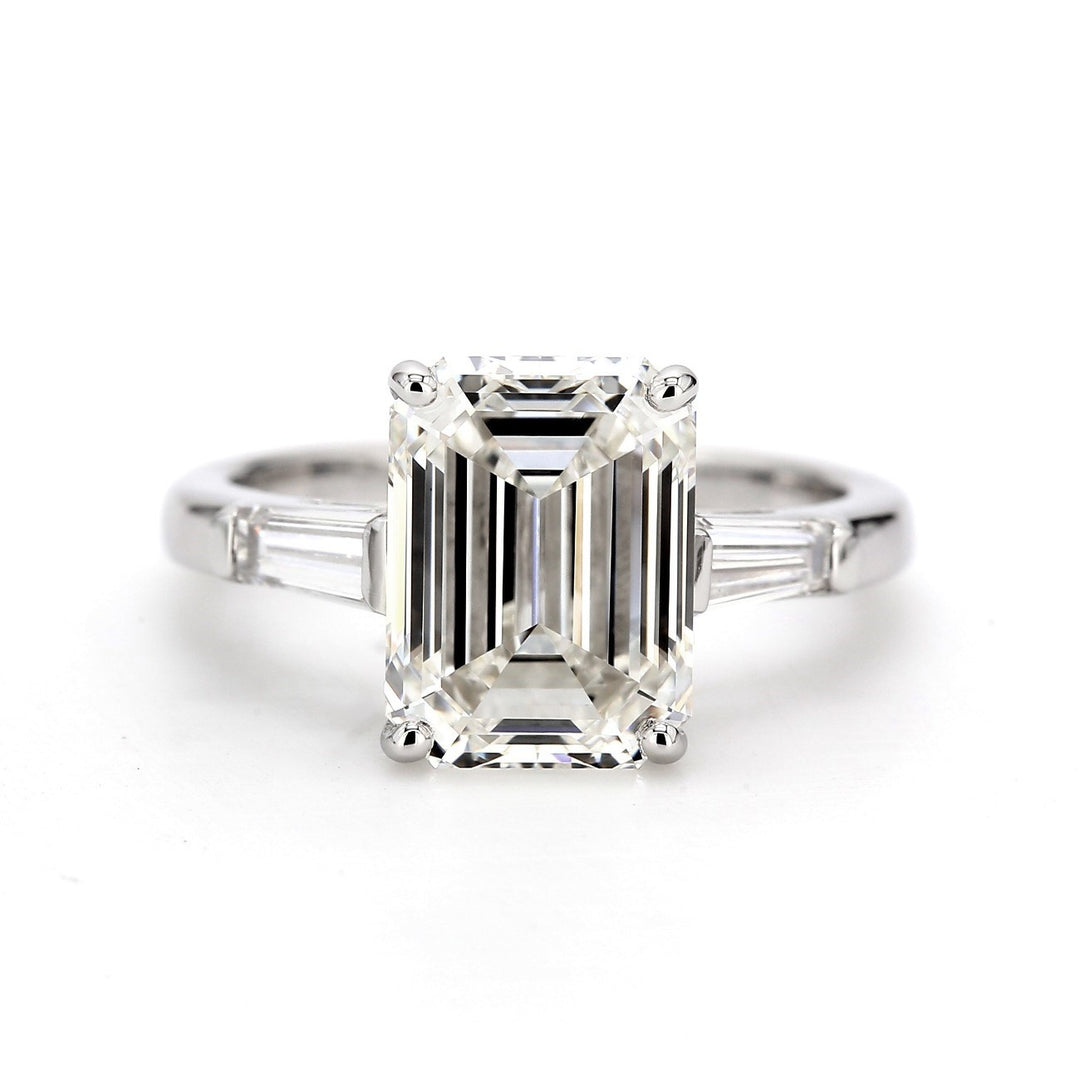 3-stone ring in platinum with GIA certified H/VS1 emerald cut center and baguette diamond sides.  D2.90ct.t.w.  (Center 2.51ct.)