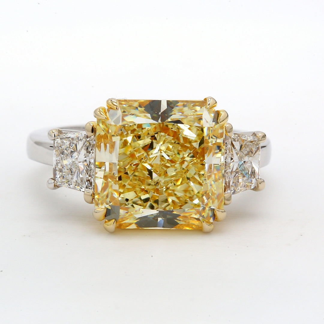 3-stone ring in 18K WG with GIA certified FLY/VS1 radiant cut center & trapezoid diamond sides.  D8.18ct.t.w.  (Center 7.23ct.)