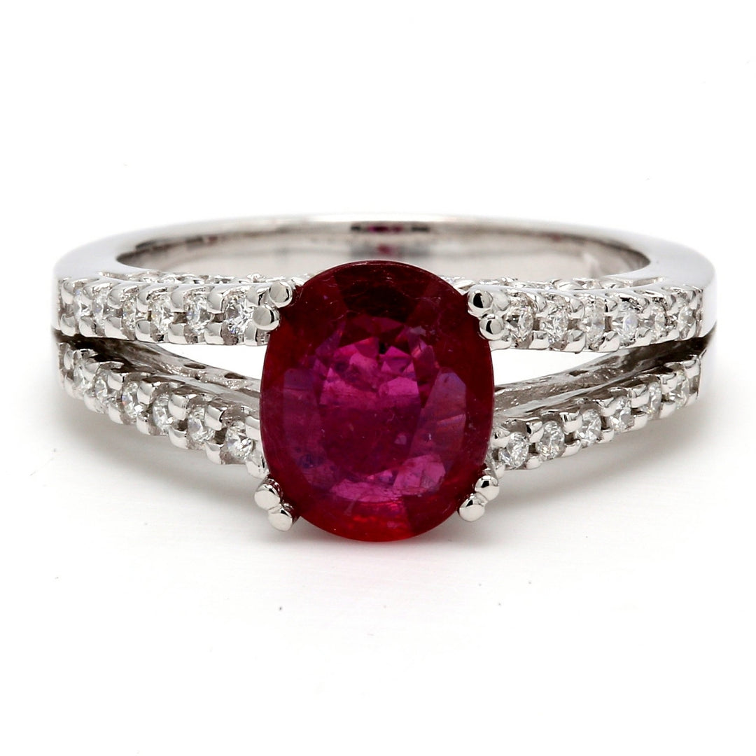 Split-shank ring in Platinum with pave set round diamonds & double 4-prong set oval shaped ruby centerstone.  D0.40ct.t.w.  Ruby 1.79ct.