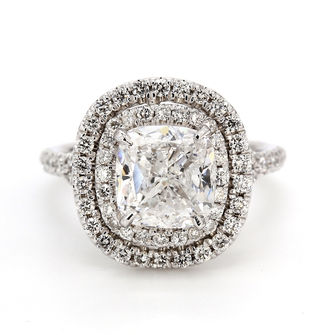 Double halo split-shank semi-mount with prong set round diamonds.  D0.86ct.t.w.
