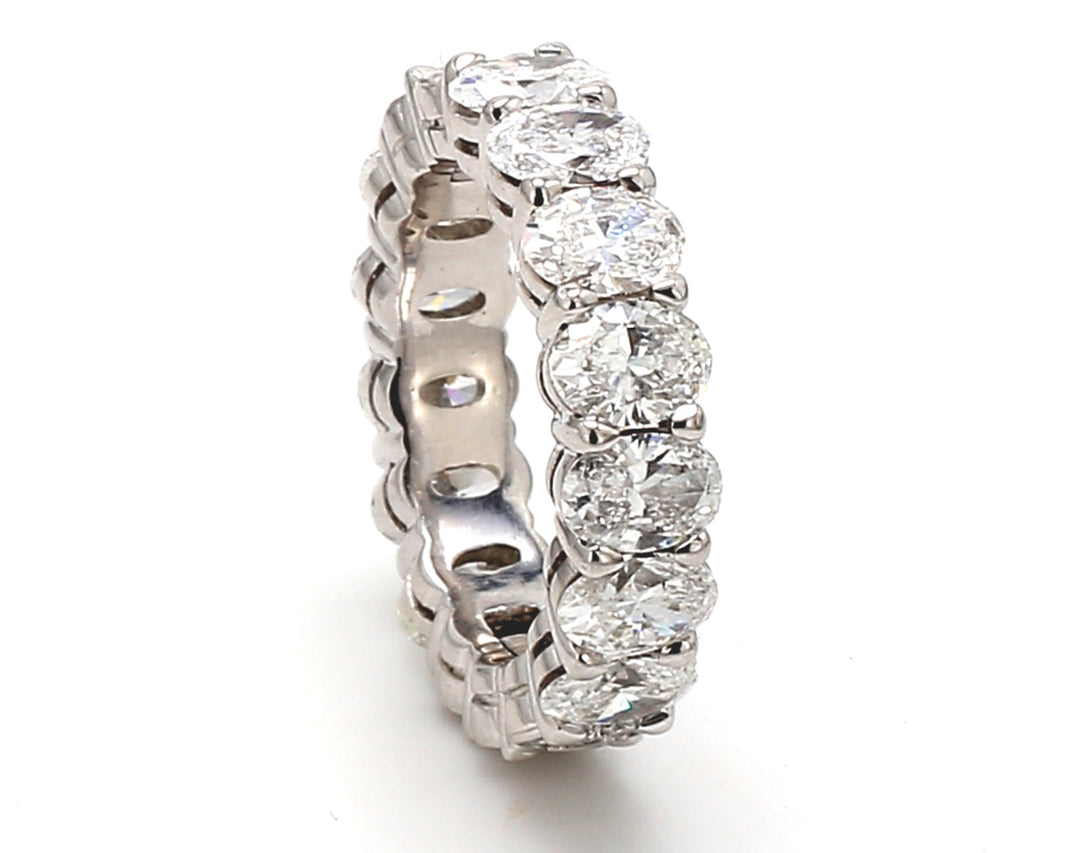 Eternity band in platinum with shared prong set oval diamonds.  D4.02ct.t.w.