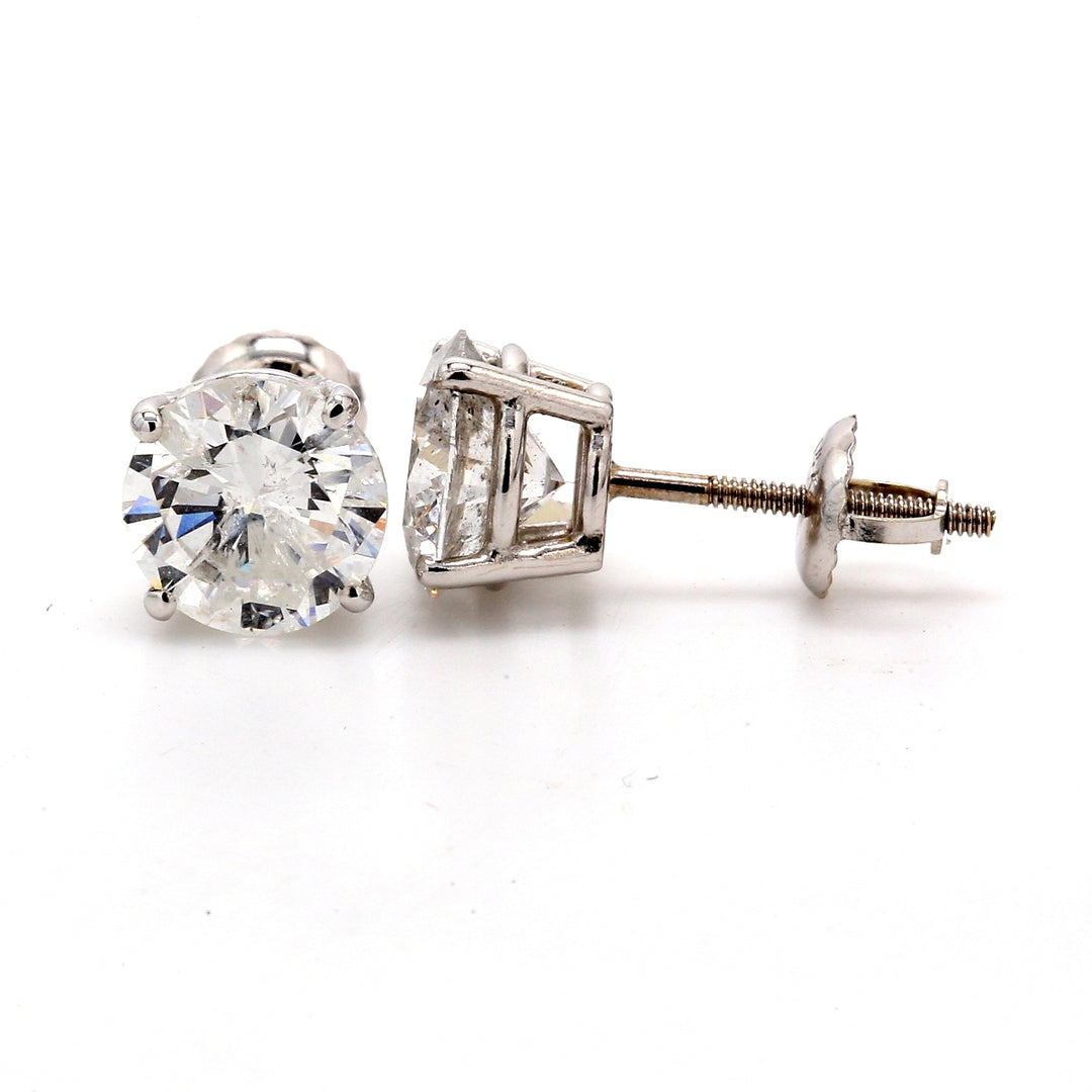 Screw back stud earrings with 4-prong set USA certified E/I1 round diamonds.  D3.25ct.t.w.