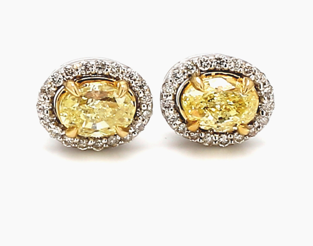 Halo earrings in with rounds around FY/VS-SI1 oval diamond center stones.  D2.04ct.t.w.  (Center - 1.80ct.t.w.)