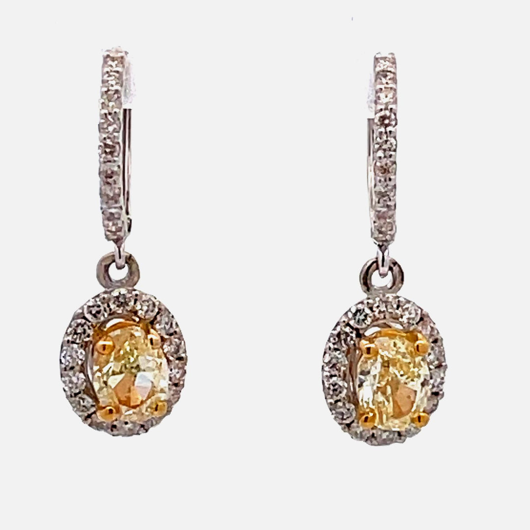 Halo dangling earrings with FY/VS2-SI1 oval diamond centers.  D 2.37ct.t.w.  (Center - 1.70ct.t.w.)