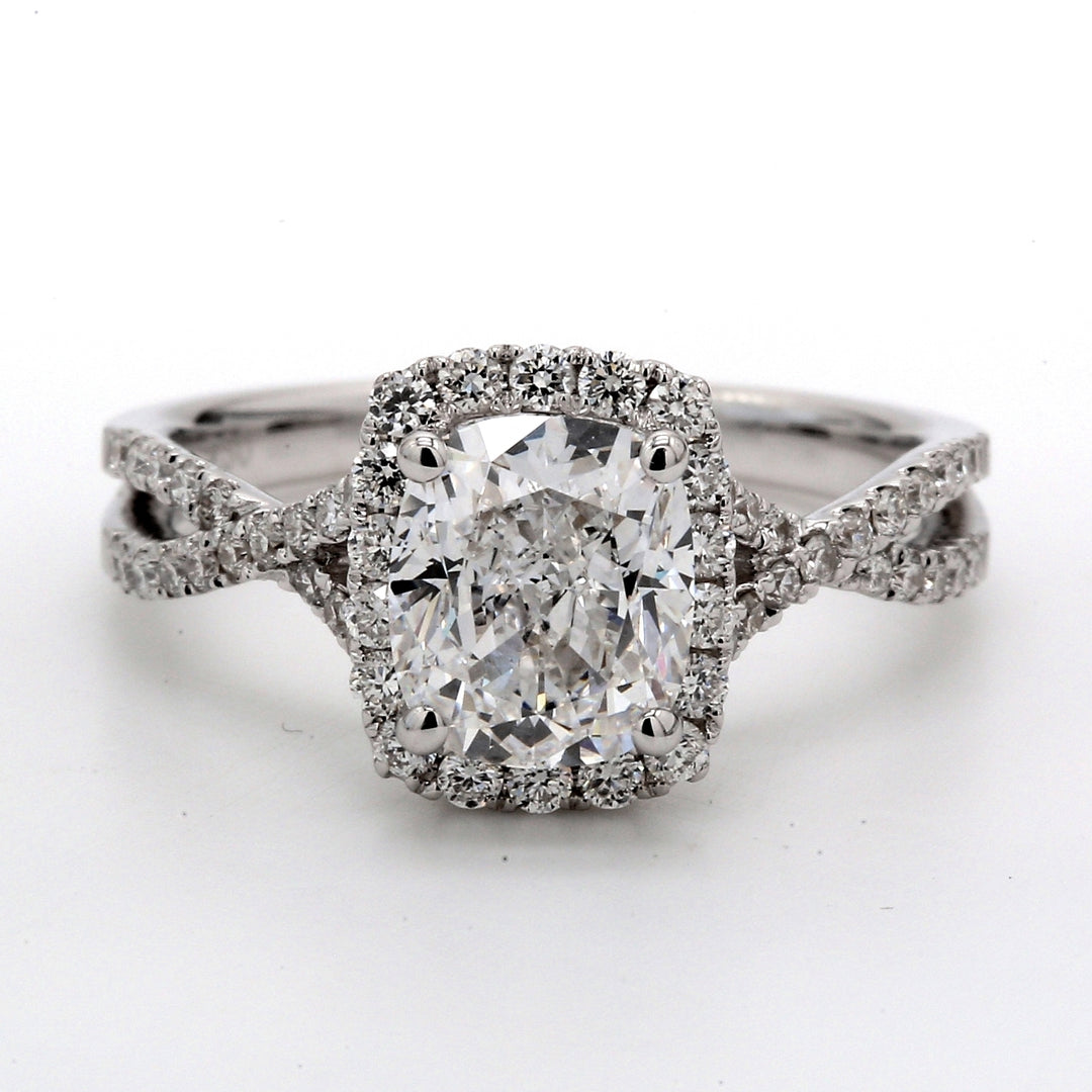 Halo semi-mount in 18K WG with U-prong set round diamonds.  D0.48ct.t.w.