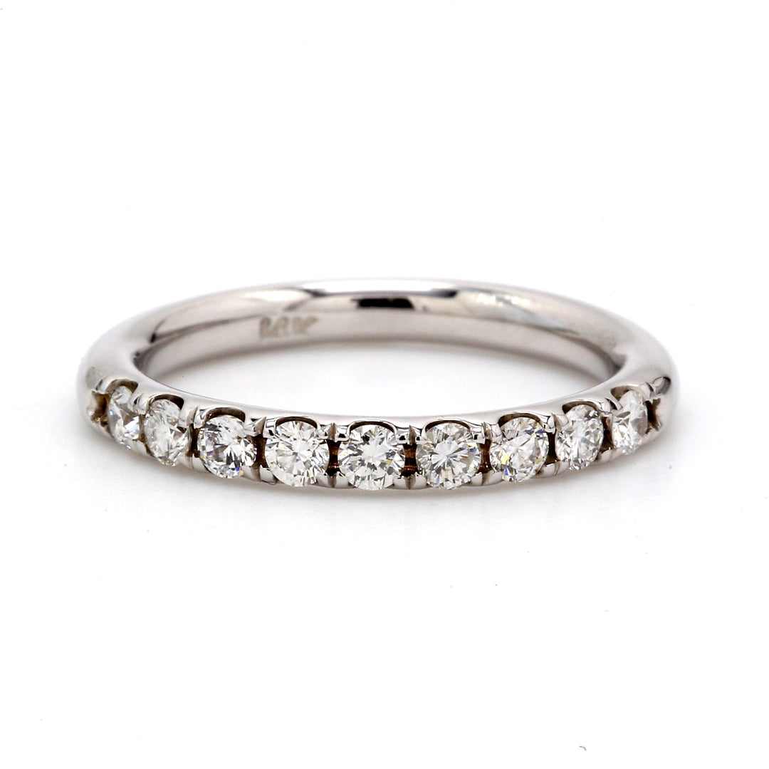 Comfort fit band with 4-prong set (9) round diamonds.  D0.44ct.t.w.  Size 6.5
