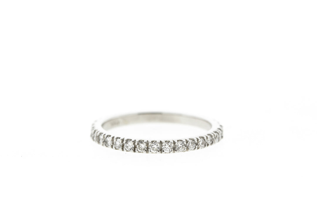 Band with 4-prong set (20) round diamonds.  D0.24ct.t.w.  Size 6.25