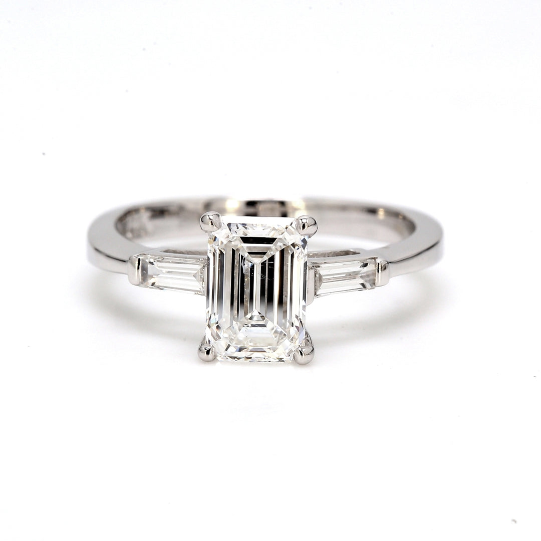 3-stone semi-mount with channel set baguette diamond sides.  D0.20ct.t.w.  Size 6.5