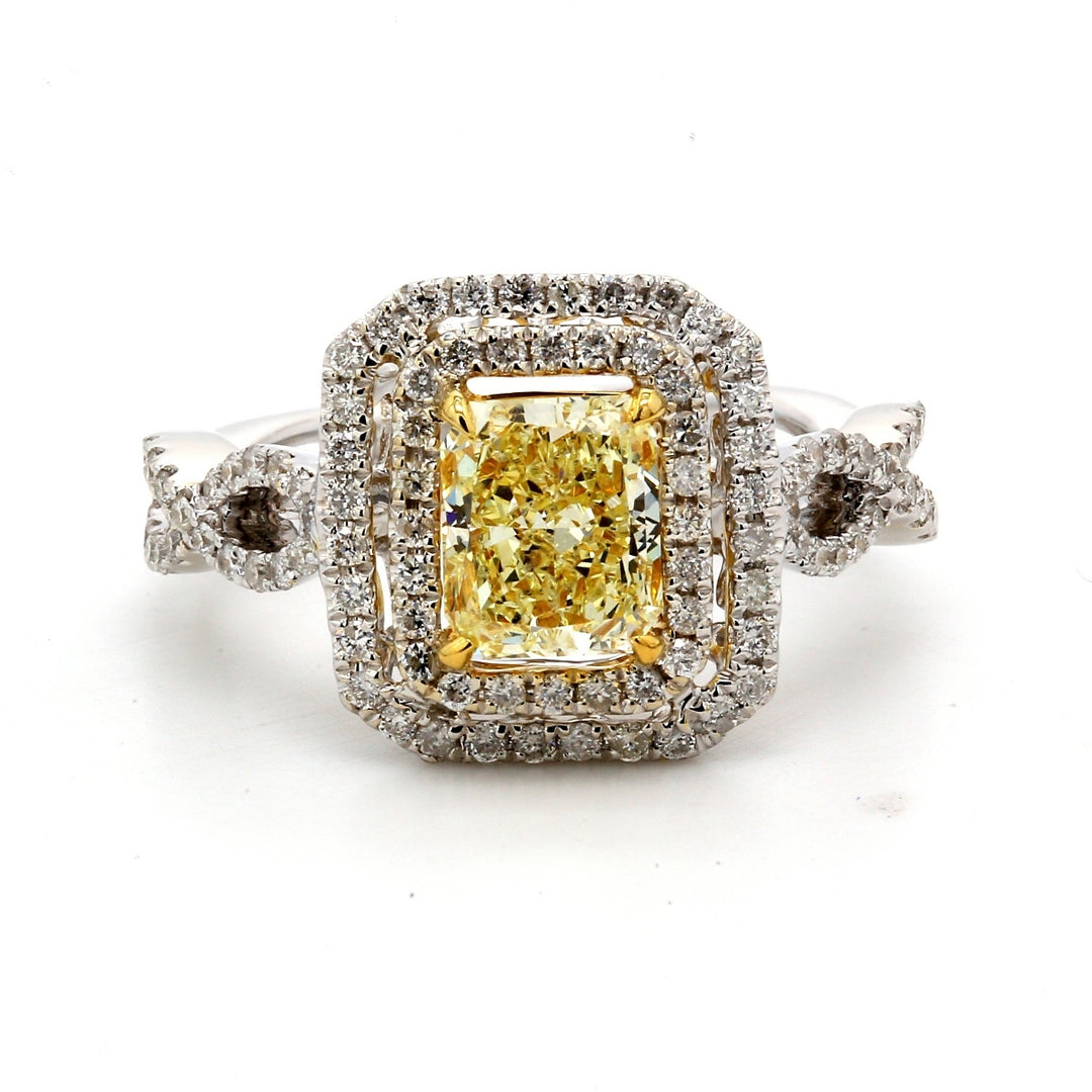 Double halo criss cross shank ring in 18K WG with rounds around GIA certified FLY/SI2 radiant diamond centerstone.  D1.60ct.t.w.  (Center 1.27ct.)