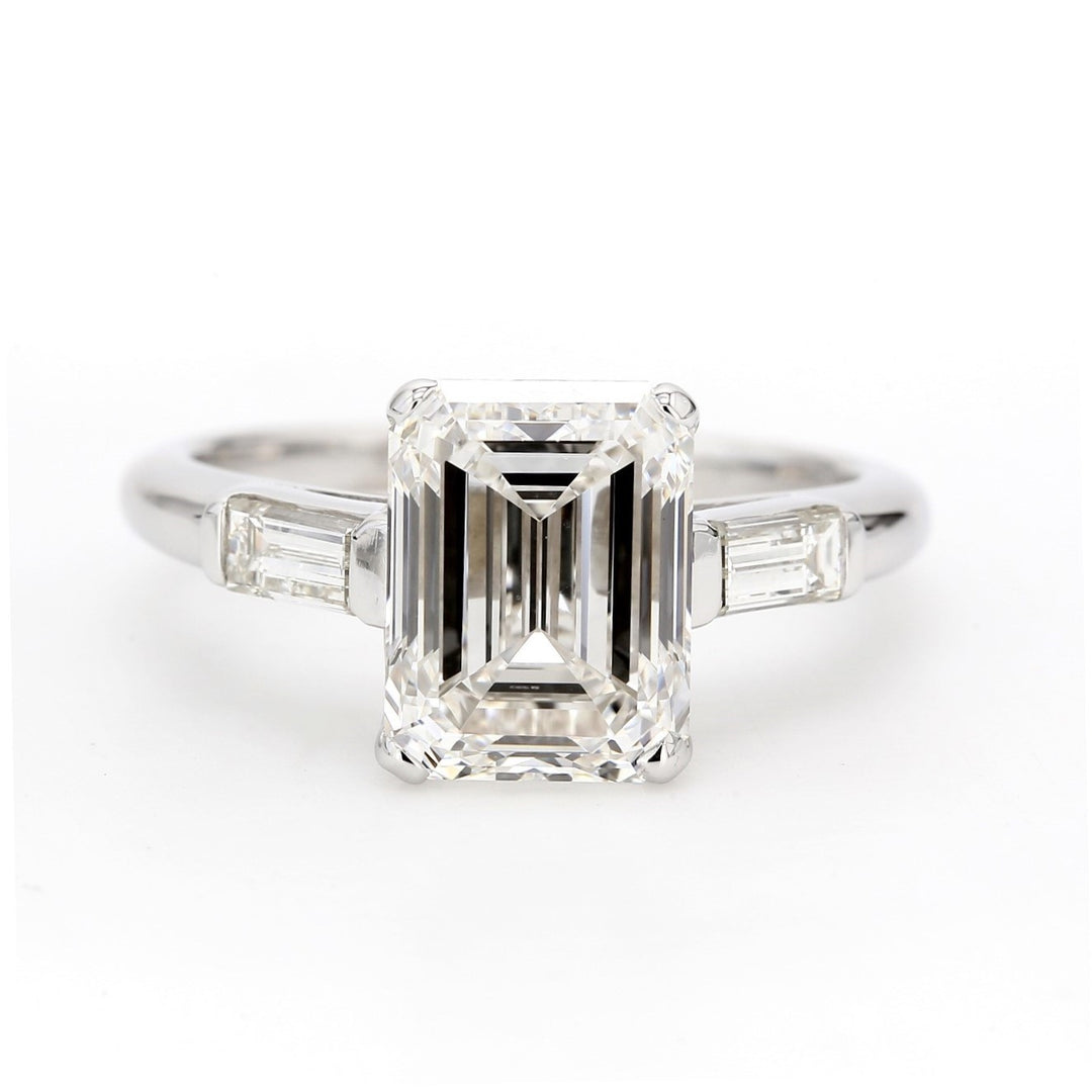 3-stone semi-mount in 18K WG with channel set baguette diamond sides.  D0.40ct.t.w.