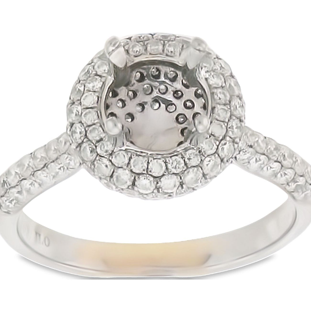 Halo semi-mount with pave set round diamonds.  D0.50ct.t.w.