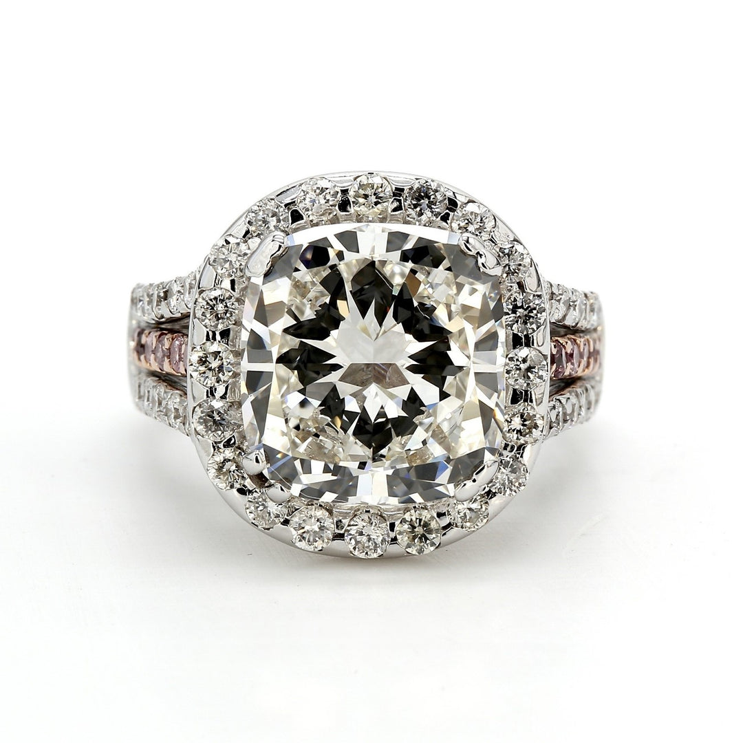 Halo ring in 18K WG with double 4-prong set GIA certified H/VS2 cushion cut center and pre-set white and pink round diamonds.  D6.36ct.t.w.  (Center 5.09ct.)