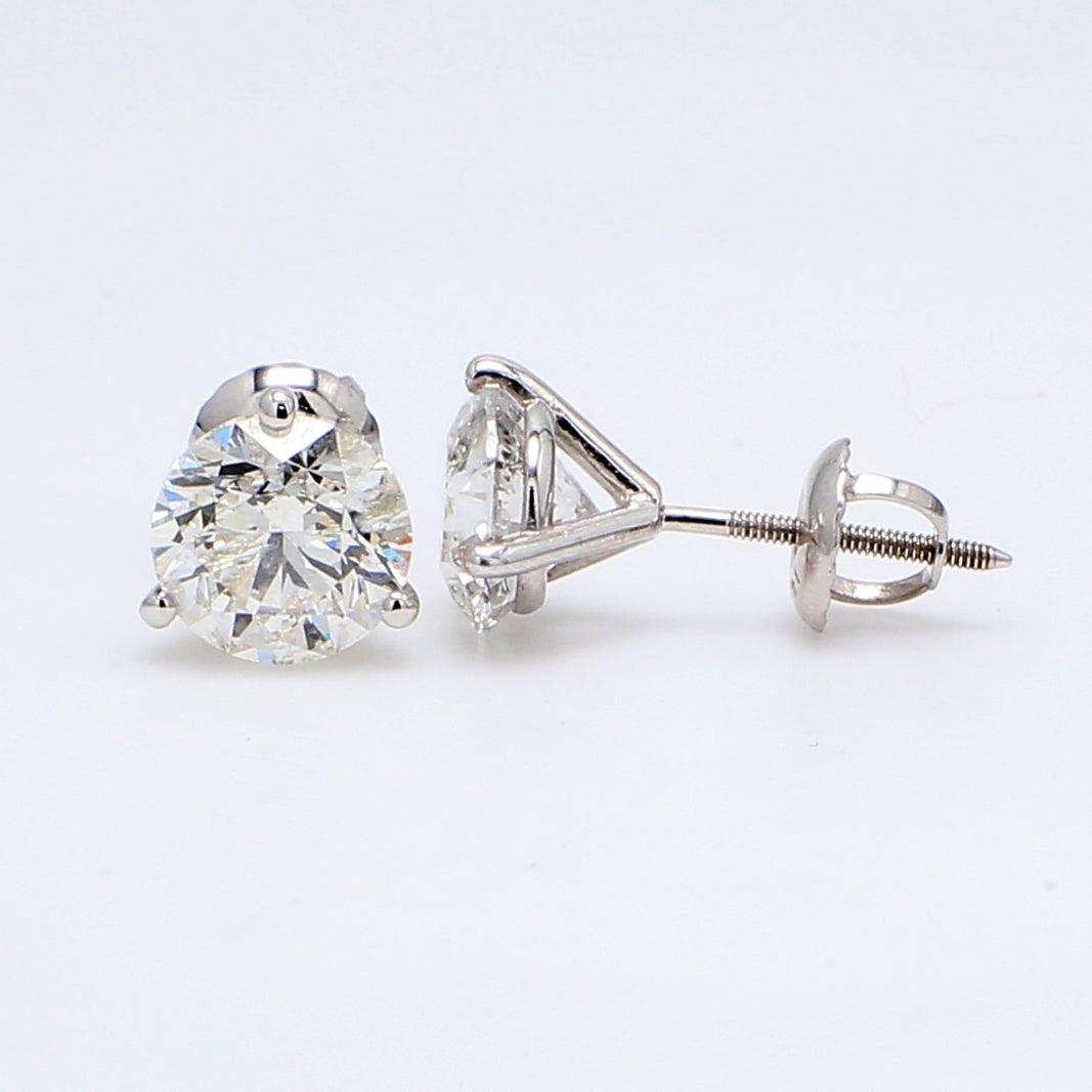 Screw back martini style stud earrings with USA certified F/SI3 round diamonds.  D2.82ct.t.w.