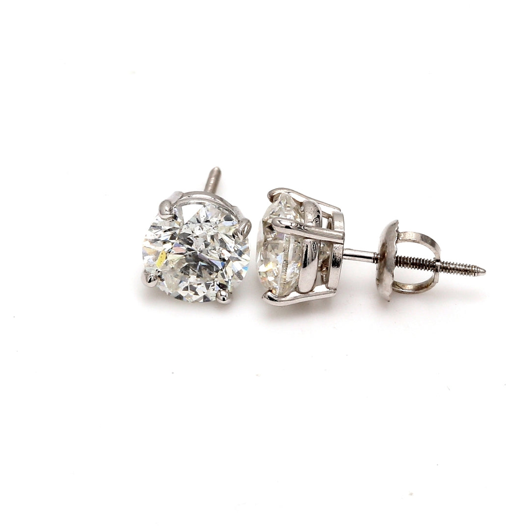 Screw back stud earrings with 4-prong set USA certified E/SI2 round diamonds.  D2.91ct.t.w.