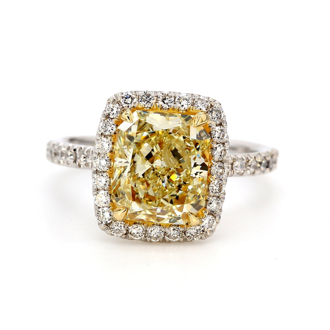 Halo ring with 4-prong set GIA certified FY/SI2 radiant cut center & prong set round diamonds.  D3.47ct.t.w.  (Center 3.03ct.)  Size 5.50