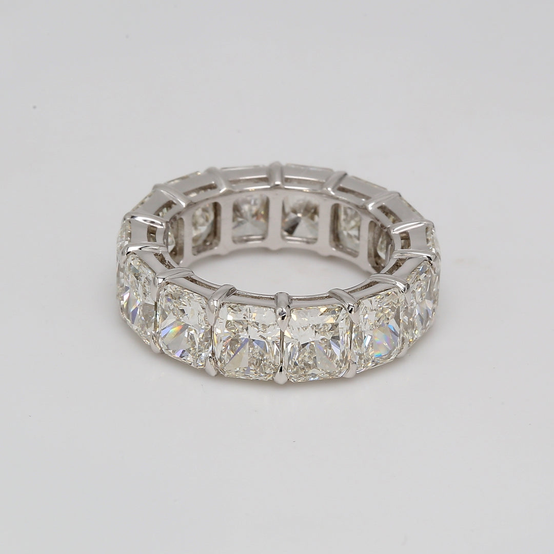 Eternity band in platinum with shared basket G-H/VS (14) radiant cut diamonds.  D10.16ct.t.w.  Size 5