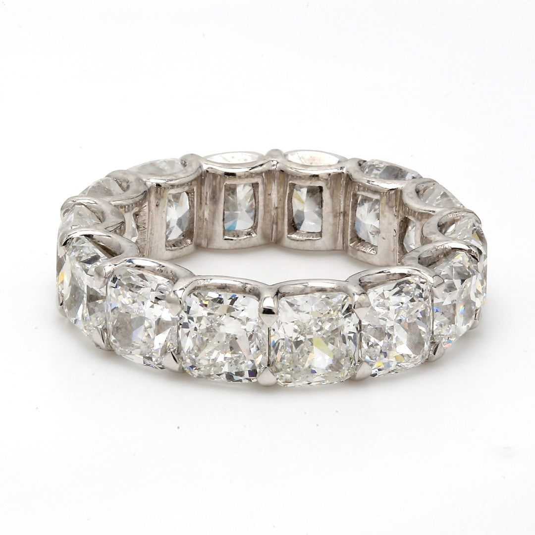 Eternity band in platinum with U-prong set D-F/VS2-SI1 (14) cushion cut diamonds.  D9.94ct.t.w.  Size 5