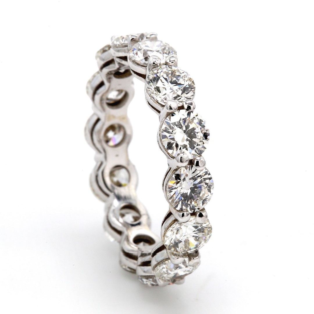 Eternity band with shared prong set (14) round diamonds.  D4.44ct.t.w.  Size 6.25