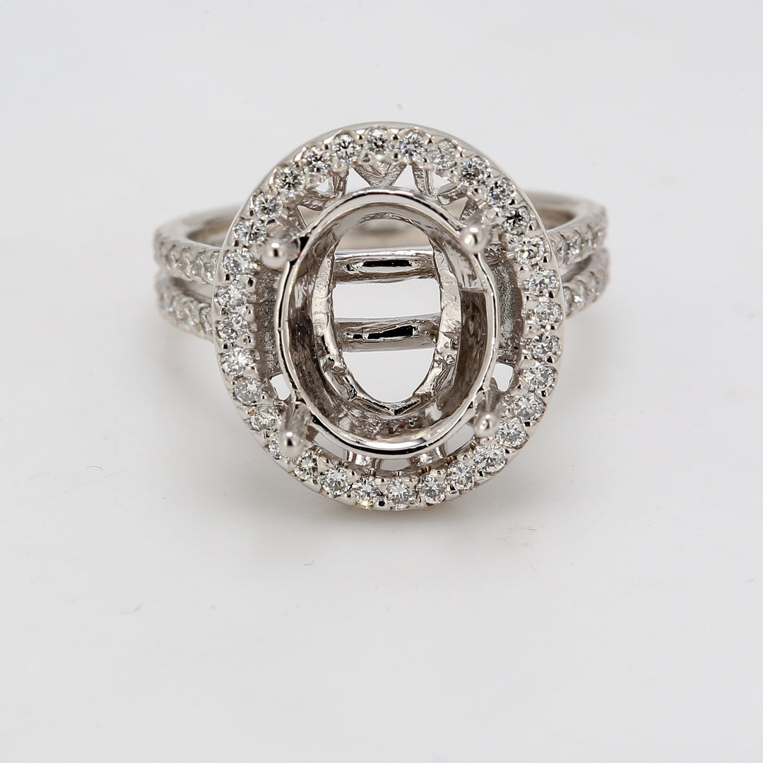 Halo semi-mount with prong set round diamonds.  D0.60ct.t.w.