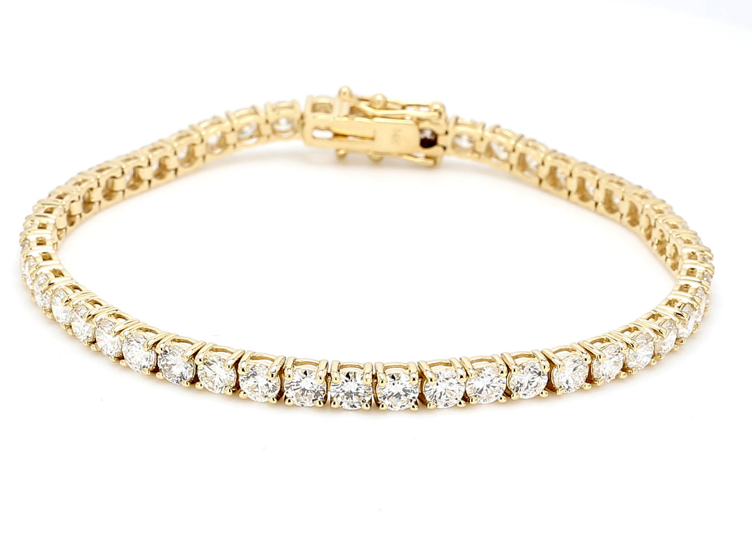 7"" Tennis bracelet in yellow gold with 4-prong set (48) round diamonds.  D8.00ct.t.w.