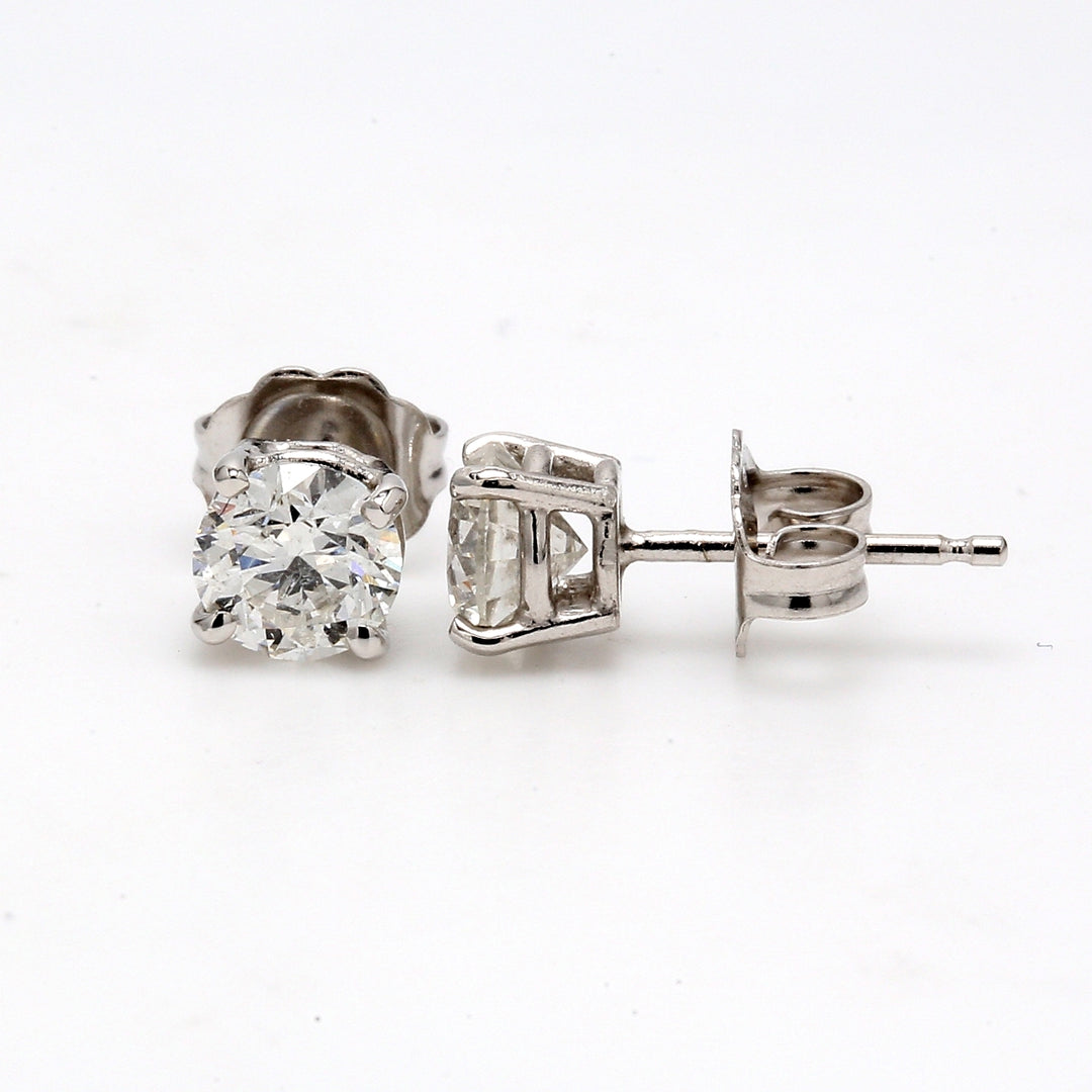 Push back stud earrings with 4-prong set USA certified F-G/SI2 round diamonds.  D1.06ct.t.w.