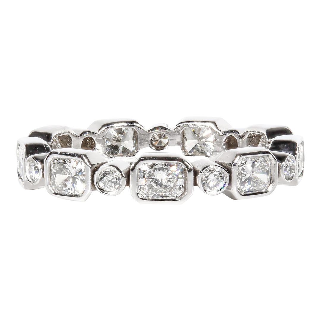 Eternity band with alternating (18) bezel set radiant and round diamonds.  D1.93ct.t.w.  Size 8.25