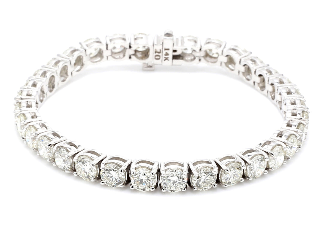 Tennis bracelet with prong set (33) round diamonds.  D16.54ct.t.w.