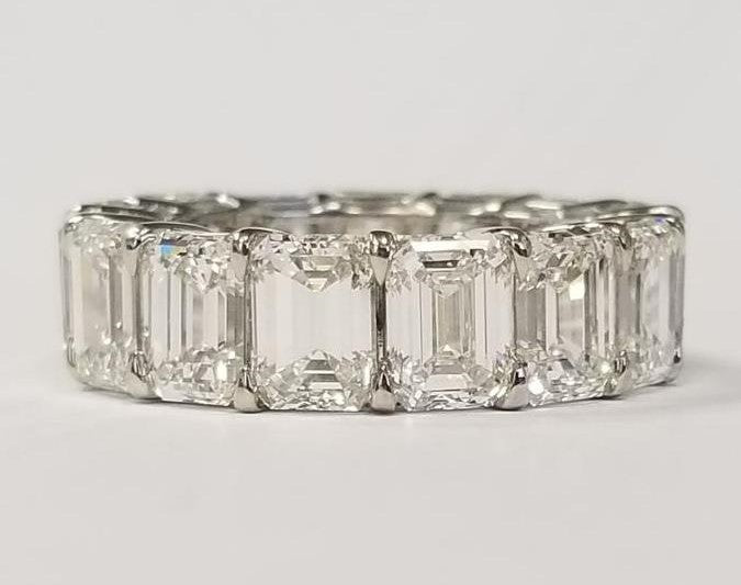 Eternity band in platinum with shared prong basket set G-H/VVS-VS (15) emerald cut diamonds.  D12.01ct.t.w.  Size 5.5