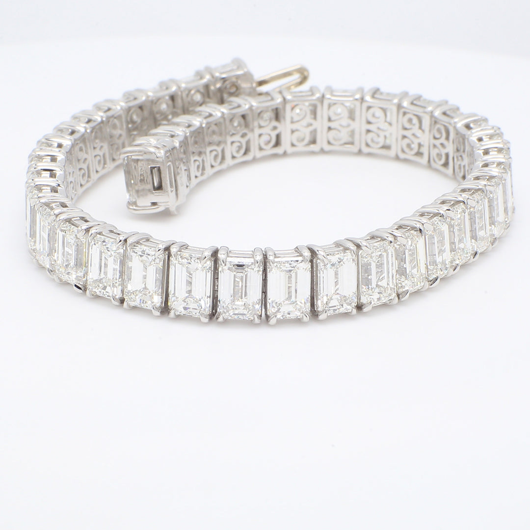 Tennis bracelet in platinum with prong set white VS+ (40) emerald cut diamonds.  D29.12ct.t.w.