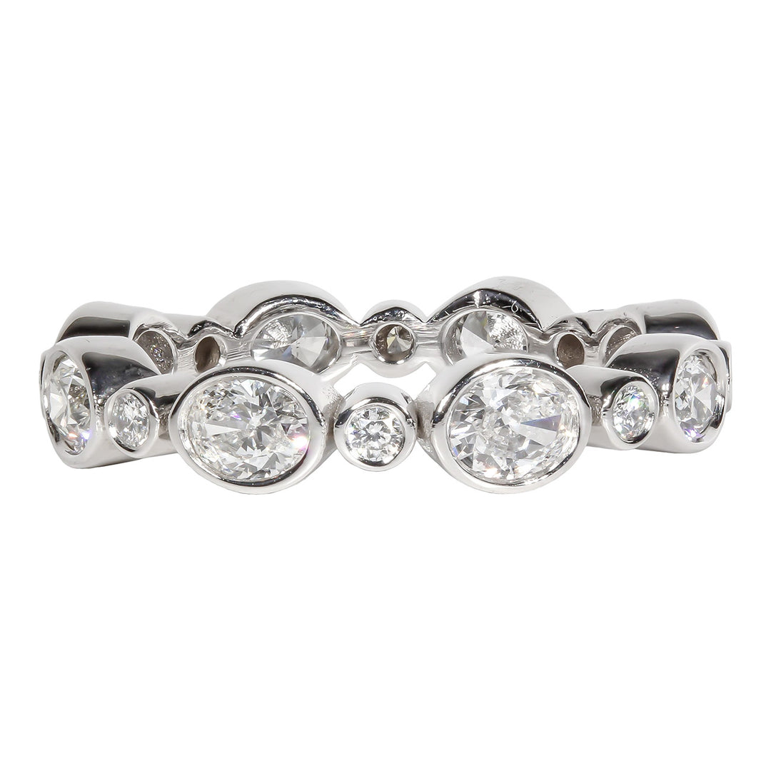 Eternity band in white gold with alternating 16 bezel set Oval and Round   diamonds. D2.07ct. t.w.  SIZE  8