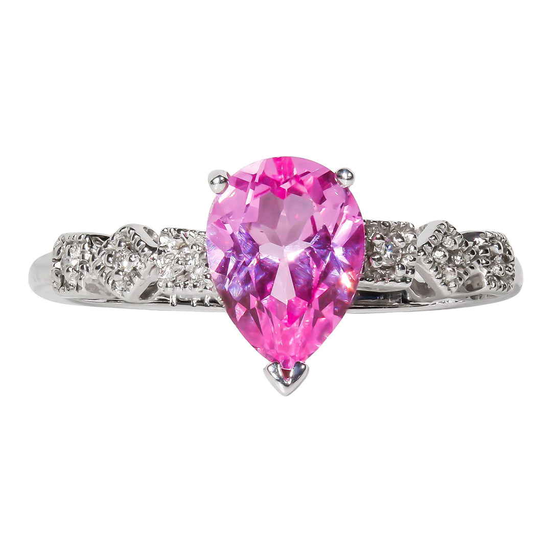 Ring with prong set rounds on shank and 3-prong set pear shape pink topaz center stone.  D0.06ct.  Topaz 1.50ct.)