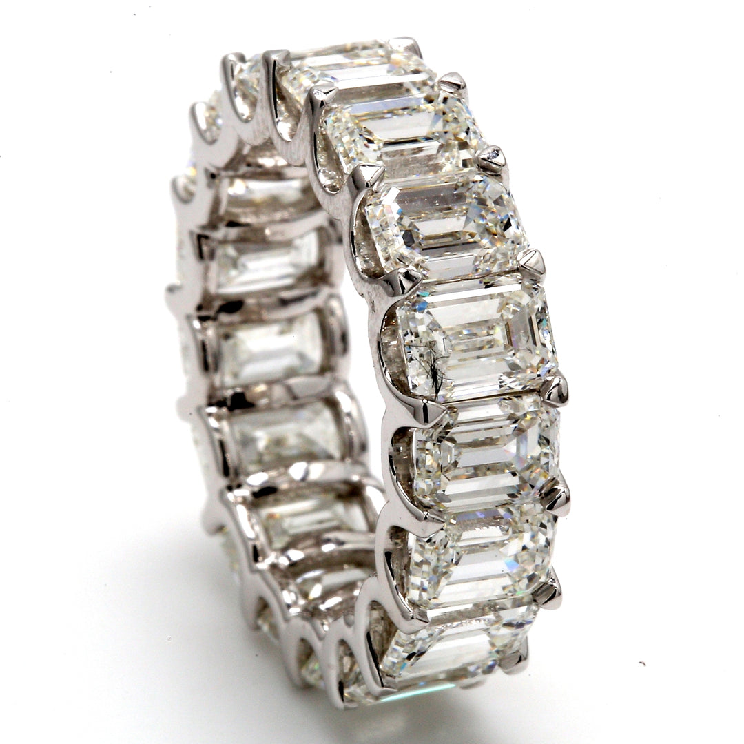 Eternity band in platinum with U-prong set GIA certified G/VVS1-VS2 (16) emerald cut diamonds.  D11.25ct.t.w.  Size 6