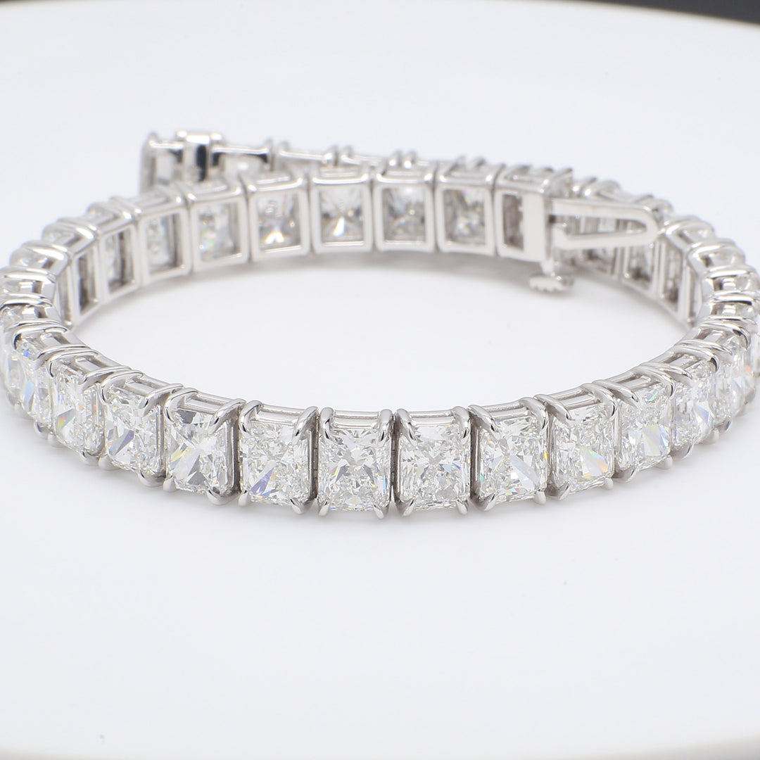 Tennis bracelet in platinum with basket prong set D-E/VVS-VS (37) radiant cut diamonds.  D27.00ct.t.w.